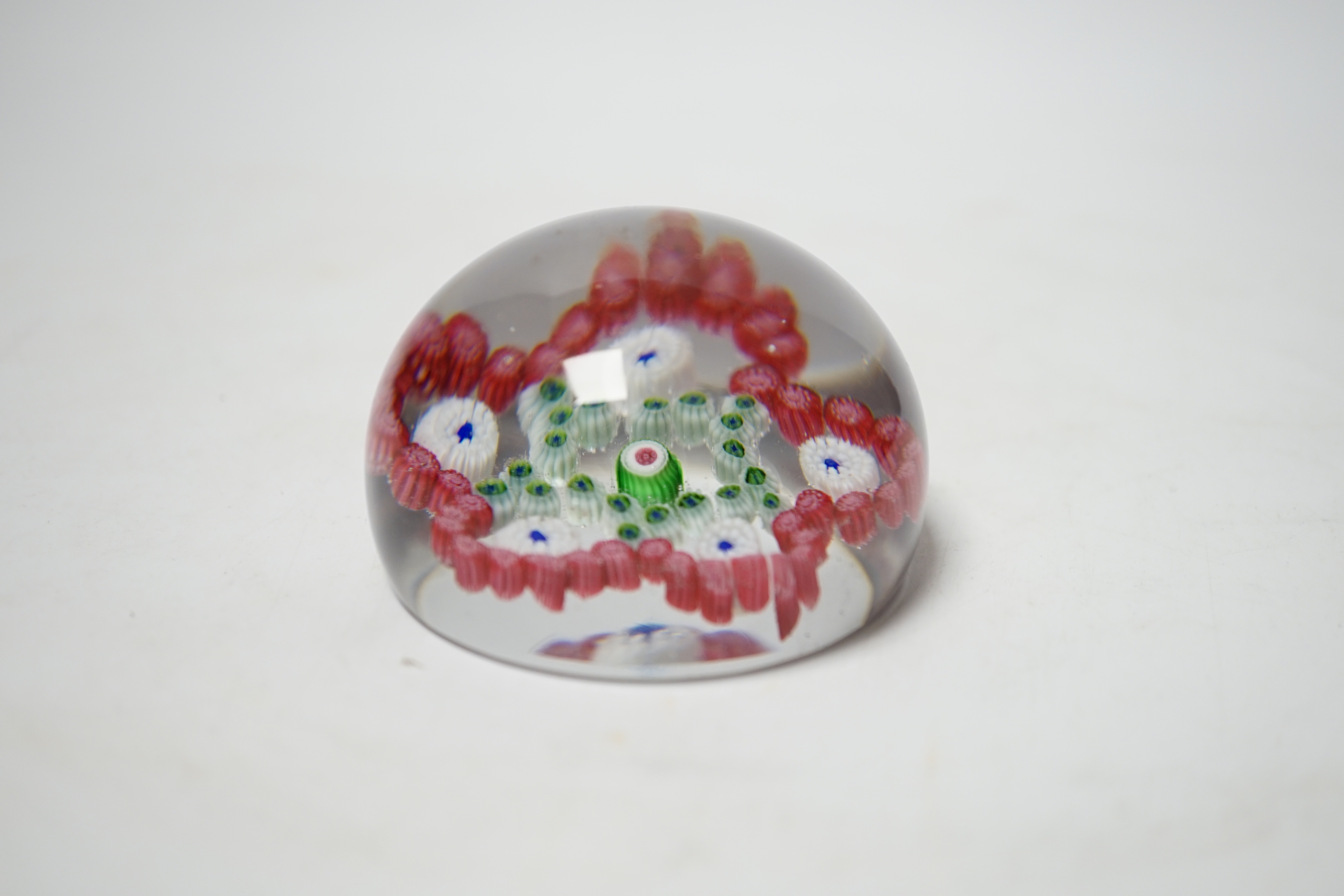 A Baccarat garlands glass paperweight, 7cm diameter